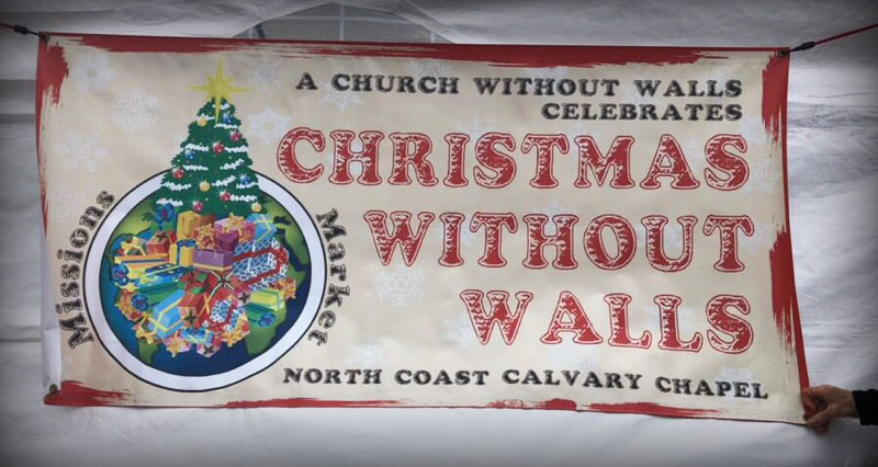 Sign from the Christmas Without Walls global market.
