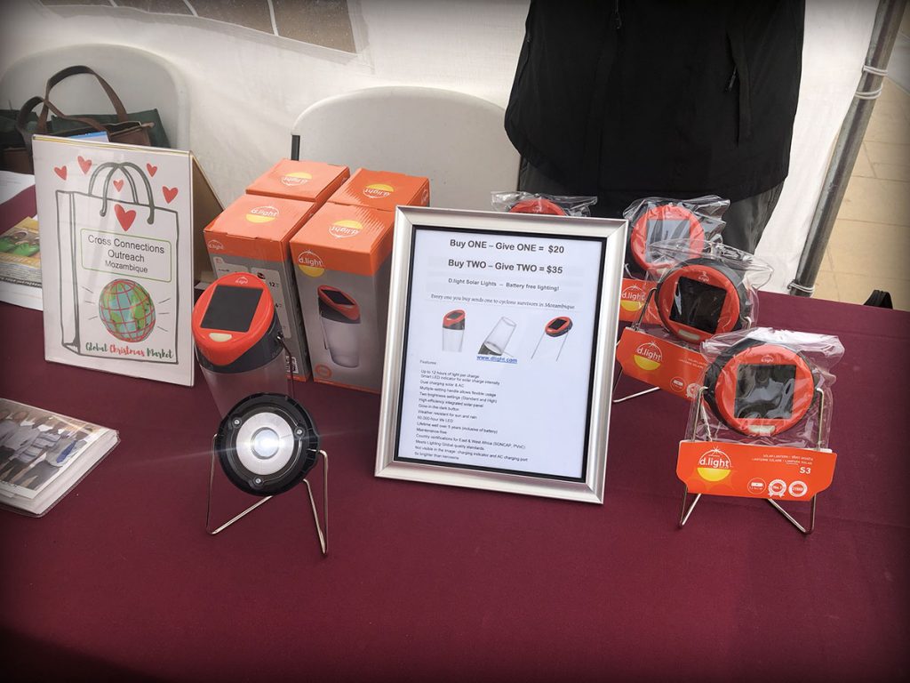 closeup of table where solar lights that charge devices are being sold.